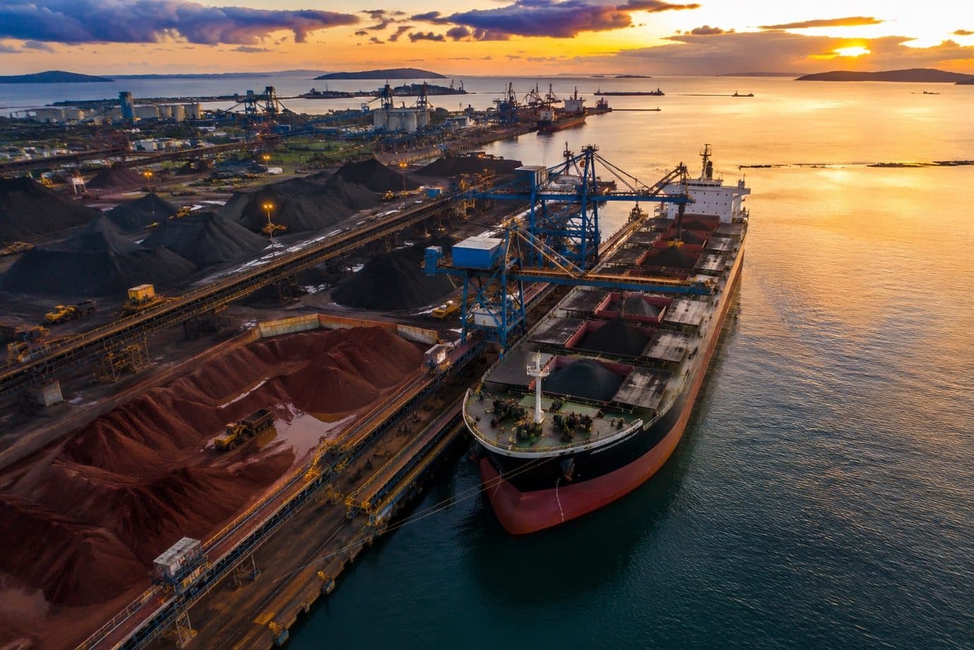 Bulk cargo vessel loading at an industrial coal port